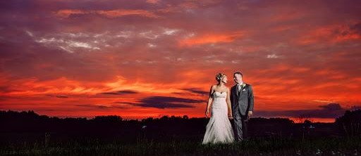 Cigar Rollers available for weddings with custom cigar bands designed and attached to imported Dominican Cigars Cigar Roller wedding at sunset