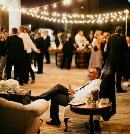 A cigar bar or cigar lounge is the perfect after dinner feature with guests relaxed and enjoying cigars while watching the cigars rolled right in front of them for a very unique wedding experience.